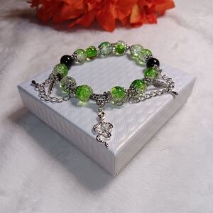 Elegant Green and Black Beaded Bracelet With Silver Accents And A Snake Charm